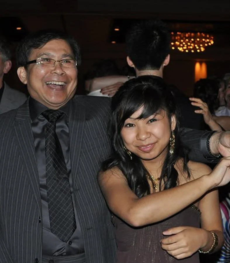 My dad and me smiling together.